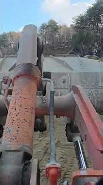 Loading sand onto a dump truck with a payloader