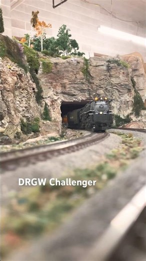 Ho scale Rio Grande 4-6-6-4 Challenger hauling passengers through a tunnel