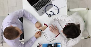 Female doctor examines nervous system and eyes of patient