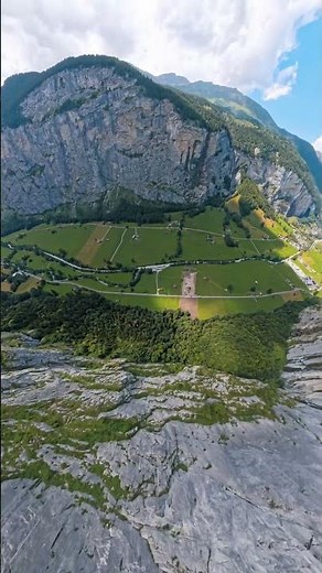 Thrilling Base Jump from a Scenic Mountain Cliff