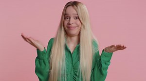 Woman raising hands in indignant expression ask why what reason of failure demonstrating disbelief