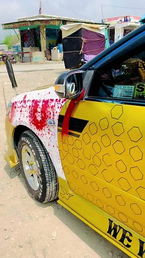 Unique Yellow Vehicle with Hexagonal Patterns on Display