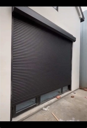 Aluminum roller shutter door with dark gray color. #rollingdoor #rollershutterdoor #rollershutter #rollupdoor #doorfactory #shopdoor #door #doors #warehousedoor #garagedoor #garagedoors #aluminumdoor #aluminumdoors #aluminiumdoors #tending #fyp