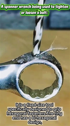 A spanner wrench being used to tighten or loosen a bolt.