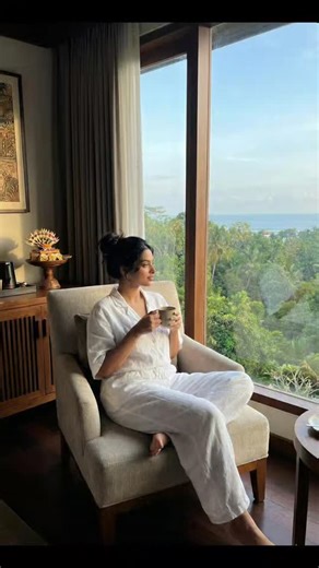 Natasha on Instagram: "Touched down. Slowed down. 🌿☕ Reached Bali—and this view already feels like therapy. White linens, morning coffee, and a hotel-room window opening into green calm and blue horizons. This is Bali hotel room bliss—where jet lag fades, breaths deepen, and the trip officially begins. Proof that sometimes the destination greets you before you even step outside. 👉 Save this for Bali stay inspiration, share it with your travel soulmate, and comment “BALI” if you’re manifesting 