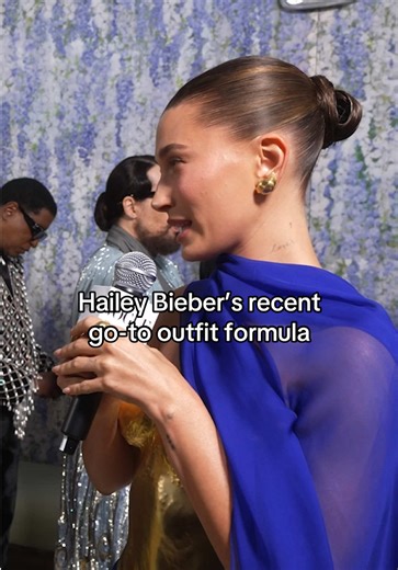 Baby heels, tees, and capris! #HaileyBieber tells #EmmaChamberlain her spring outfit formula. But as for last night’s look, get all the details on Hailey’s custom #MetGala #YSL gown at the link.