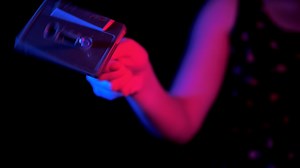 80s Girl Manually Rewind a Cassette Tape