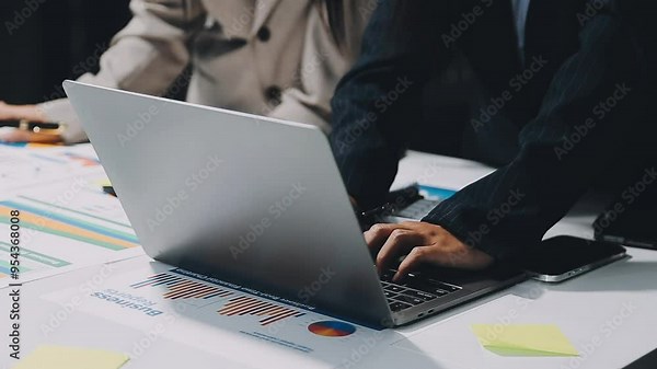 Financial Businessman analyze the graph of the company's performance to create profits and growth, Market research reports and income statistics, Financial and Accounting concept.