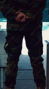 Vertical Video Colonel overseeing special operation to gather intelligence in control center with CCTV surveillance information on a big screen. Specialist targeting enemy military power base. Camera