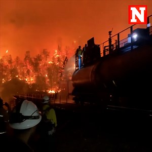 A Union Pacific fire train was sent out to help eliminate the Salt Fire flames in Shasta National Forest, California. 70 percent of the fire was contained and evacuations orders were lifted. | Newsweek