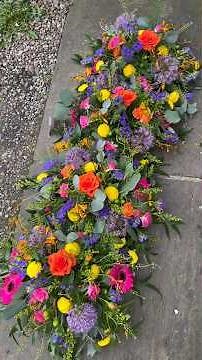 Creating posy arrangements for a coffin top #funeralflowers #floraltribute #florist