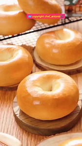 Homemade Bagel 🥯 preparation in the mixer bowl bread flour 300g water 180ml instant yeast 5g salt 3g sugar 8g butter 10g knead the dough for 12min cover the dough rest the dough for 25min separate the dough into 6 pieces each piece 80g make balls cover the dough refrigerator for 30min flour on the working surface make the bagels roll the dough roll it up slightly and make it about 22 cm roll up the 2 ends, and pinch the ends tightly to prevent them from cracking during baking. baking paper ferm