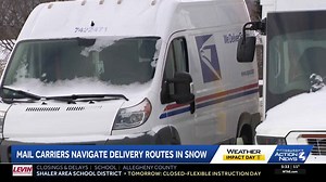 Mail carriers navigate delivery routes in the snow