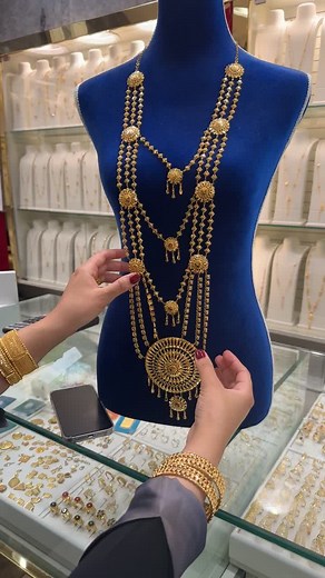 Intricate Gold Necklace Display in Jewelry Store