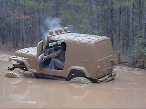 redneck jeep wrangler in the mud bog mudrun jedburg