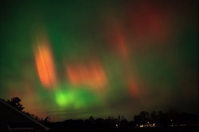 Aurora borealis curtain illuminates Johnston, Iowa, USA