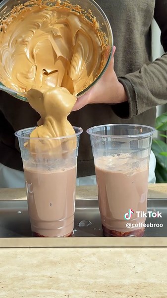 You should try this coffee combo! Fluffy coffee with chocolate milk Ingredients Instant Coffee 3 tablespoons Sugar 3 tablespoons Hot water 6 tablespoons Mix well for 2-3 minutes Chocolate syrup Milk of choice Ice cubes Makes 3 servings Would you try this? #fluffycoffee #dalgona #coffeebro