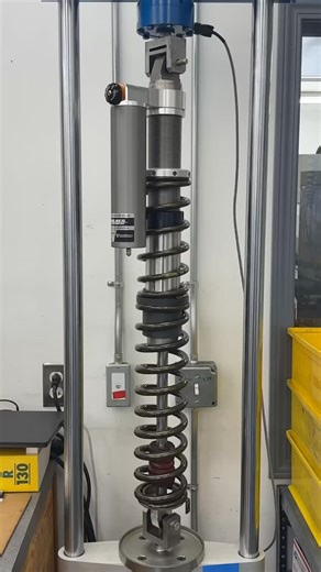 Testing SxS Spring Kits for coil bind on our Spring Press! #sxs #landrum #springkit #walkerevans #springpress | Hygear Suspension