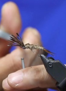 Stonefly Materials List: Hook: Ahrex 531 size 12 Weight: .020 lead wire Antenna/tail: Goose biots Body: Hares mask Backing: Pheasant tail Ribbing: Small gold wire Legs: Hungarian partridge UV Resin: Solarez Bone Dry | The Tao of Flies