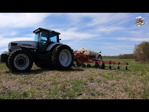 Agco White 6215 Tractor pulling a Farm King Applicator