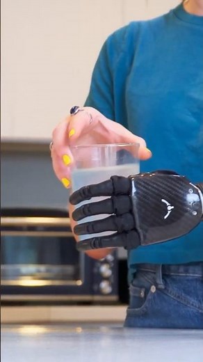 Holding a glass with a bionic hand
