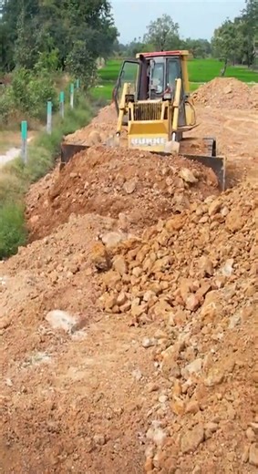 Bulldozer Action Pushing Soil into Low Land #bulldozer #caterpillar #reelsusa #heavyequipment #construction #earthmoving | Construction World