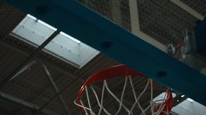 High school team basketball player practicing dunks indoors. 4K UHD | Free Stock Video Footage