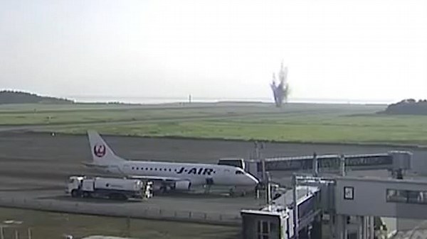 Dramatic moment as WWII bomb explodes near airport runway in Japan
