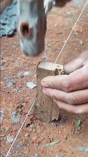 the process of sticking a piece of wood as a measuring tool in a construction project