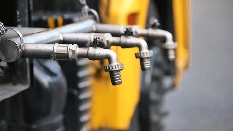 clip-4007756565-hands-filling-plastic-water-bottles-multiple-taps