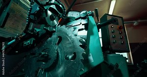 Sharpening an industrial circular saw. Circular saw blade for sawing timber. Woodworking industry.