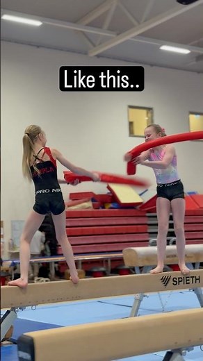 Gymnasts Fight to Stay on the Beam!