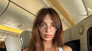 Emily Ratajkowski looks stunning in strapless mini dress and thigh-high boots