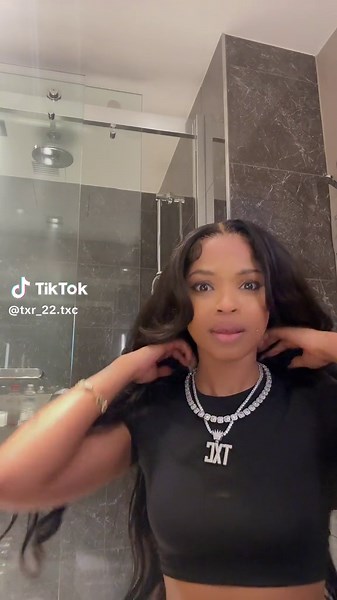 Stylish Outfit Showcase in Modern Bathroom Setting