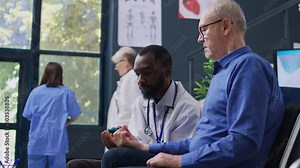 Practitioner measuring sugar level with blood sample to do insulin test with glucometer for elderly patient with diabetes. Doctor checking glucose at checkup examination in hospital waiting room
