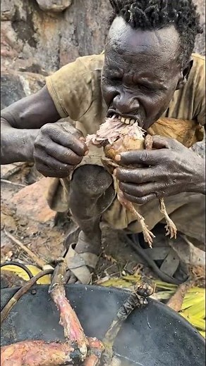 The hadzabe tribe cooks and eats wild birds in an ancient way #short