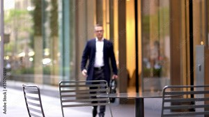 Successful male entrepreneur in classic glasses and elegant clothing using roaming internet for talking via smartphone application while using touch pad for administrative job for planning business