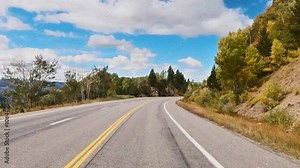 Immersive drivers point of view traversing rural Colorado on a cloudy afternoon in early autumn.