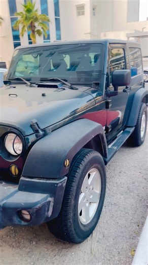 This is a black two-door Jeep Wrangler (JK generation) Sport model #jeepwagoneer #wranglersahara