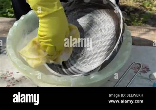 Close-up of female hands washing dishes in the sink with a sponge. yellow latex gloves Stock Video Footage - Alamy
