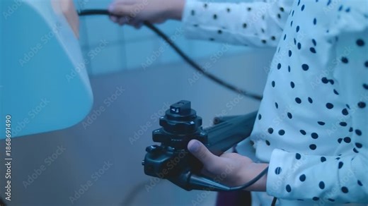 A child is learning the profession of a doctor on a simulator – performing an endoscopic examination of the stomach. Closeup