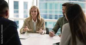 Pretty businesslady hold formal meeting with partners or colleagues, make speech, share insights and opinion, conduct negotiations met with shareholders in board room. Business, solutions, leadership
