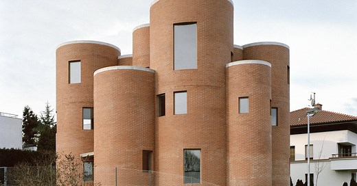 christian kerez's house okamura unfolds as a cluster of circular brick volumes in czechia