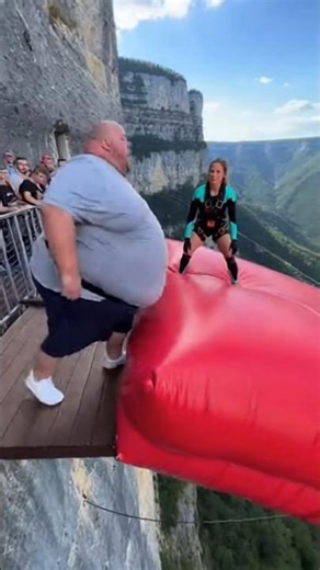 Cliff airbag is wild! Guy jumps, girl flies! #ScaryRide #TravelWonder#ytshorts