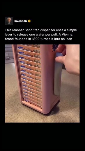 Invention on Instagram: "This Manner Schnitten dispenser operates using a simple lever mechanism that releases a single wafer pack with each pull. The motion is entirely mechanical, relying on gravity and internal guides to control portioning and reset the system for the next use. Designs like this prioritize reliability and clarity. One action produces one result, making the process intuitive, durable, and satisfying to watch. The visible mechanics also highlight how effective basic engineering
