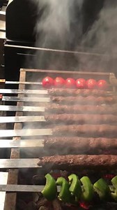 Kabob Koobideh is a popular Iranian street food usually grilled over hot coals. You will find it served right off the grill at modest little shacks scattered around parks, in indoor bazaars, even on the menu of fancy restaurants. The heavenly aroma that fills the air will lead you to a vendor, or as we call “Kabobi” (the kabob guy) with a small charcoal grill and a bowl of ground lamb mixed with chopped onions and spices. He will probably have plenty of sangak or lavash on the side to make a qui