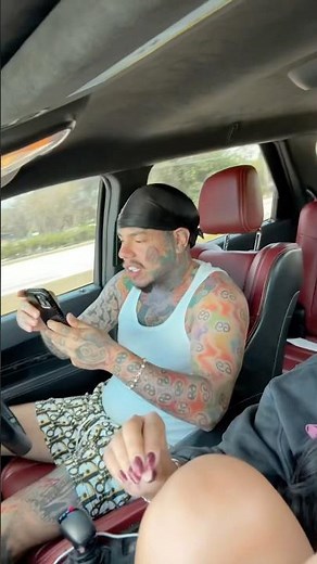 6ix9ine and his girlfriend Hallel Genesis recording a video in his Rolls Royce
