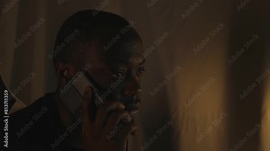 Black Male On A Serious Phone Call At Home Office