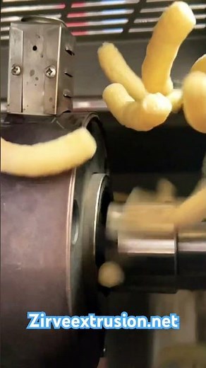 High-pressure corn chip extruder, producing 40+ shapes, designed for continuous operation for days.