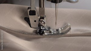 Sewing machine slow stitching. Sewing fabric by sewing machine. Sewing machine needle slow moving up and down. 4K
